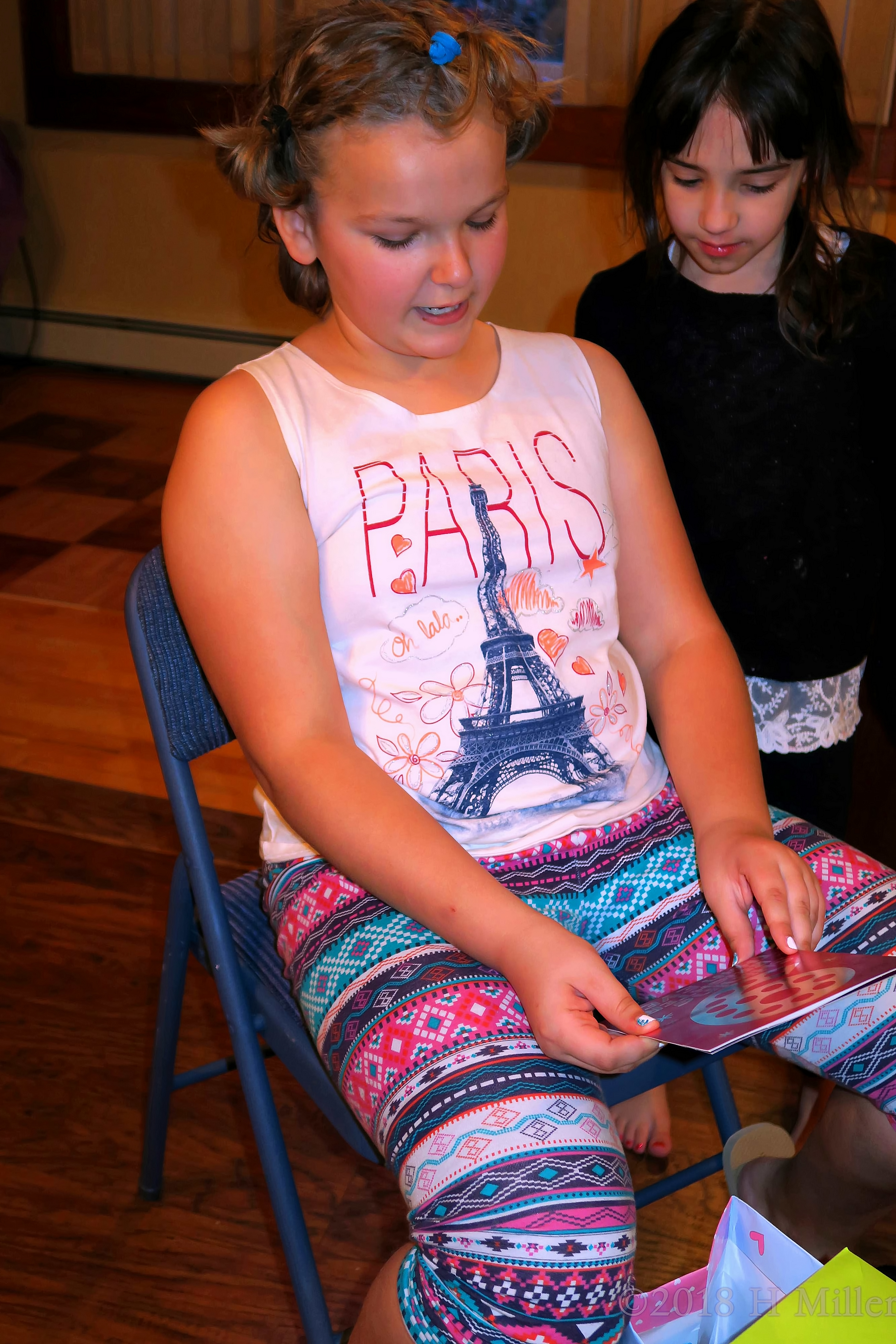 Leaning Back To Read Card At The Birthday Party Leaning Back To Read Card At The Birthday Party