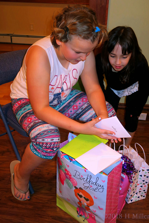 Birthday Girl Opening Card With Her Friend