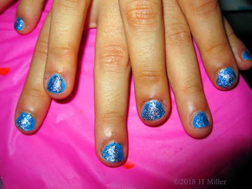 Cheerful Silver Sparkly Kids Manicure Closeup 