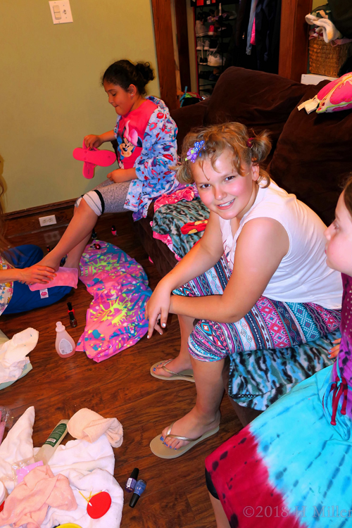 Friend Gets Pedicure In The Background While Madison Grins Friend Gets Pedicure In The Background While Madison Grins