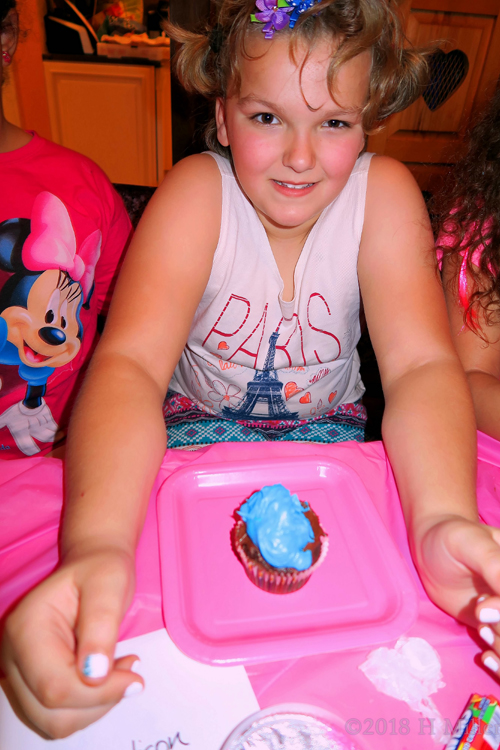 Madison With Blue Iced Cupcake