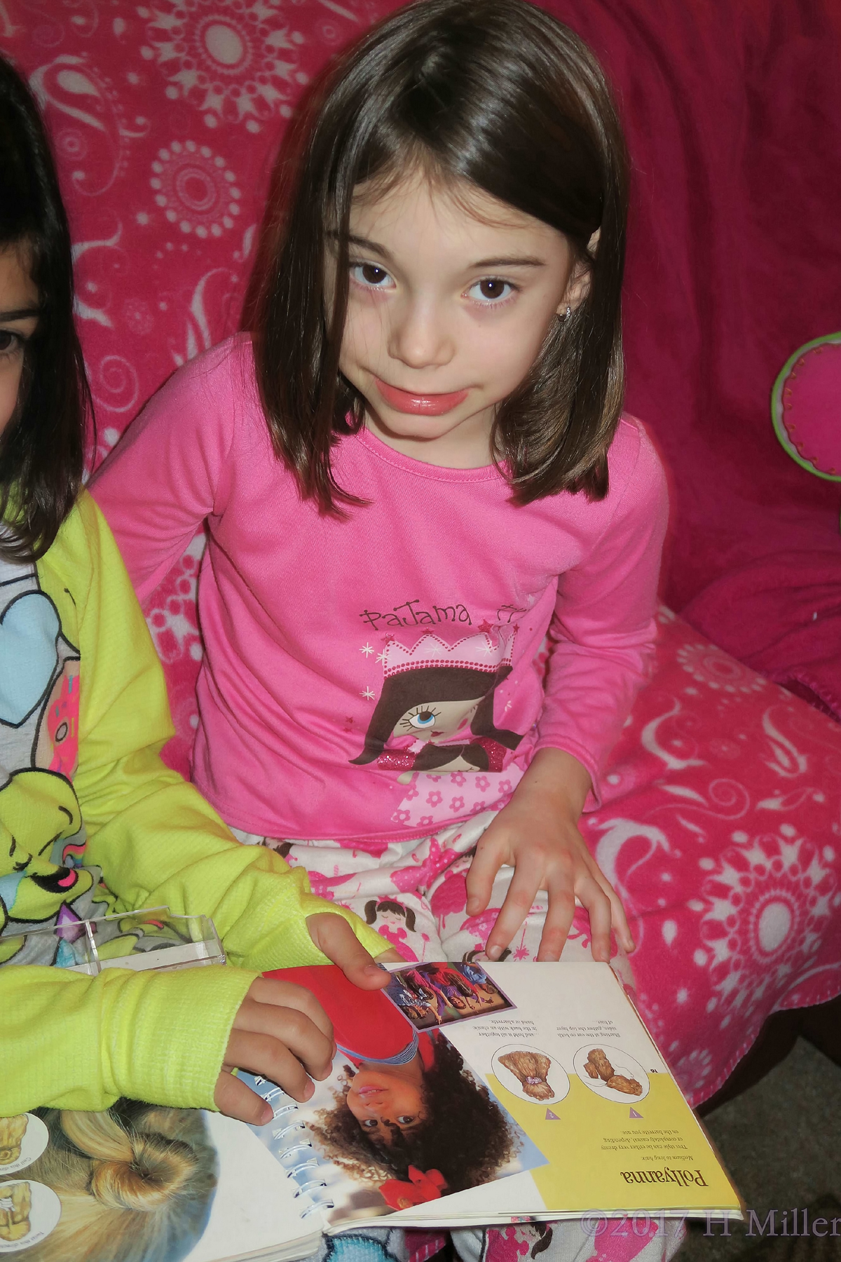Madison Reading The Girls Hairstyles Book. 