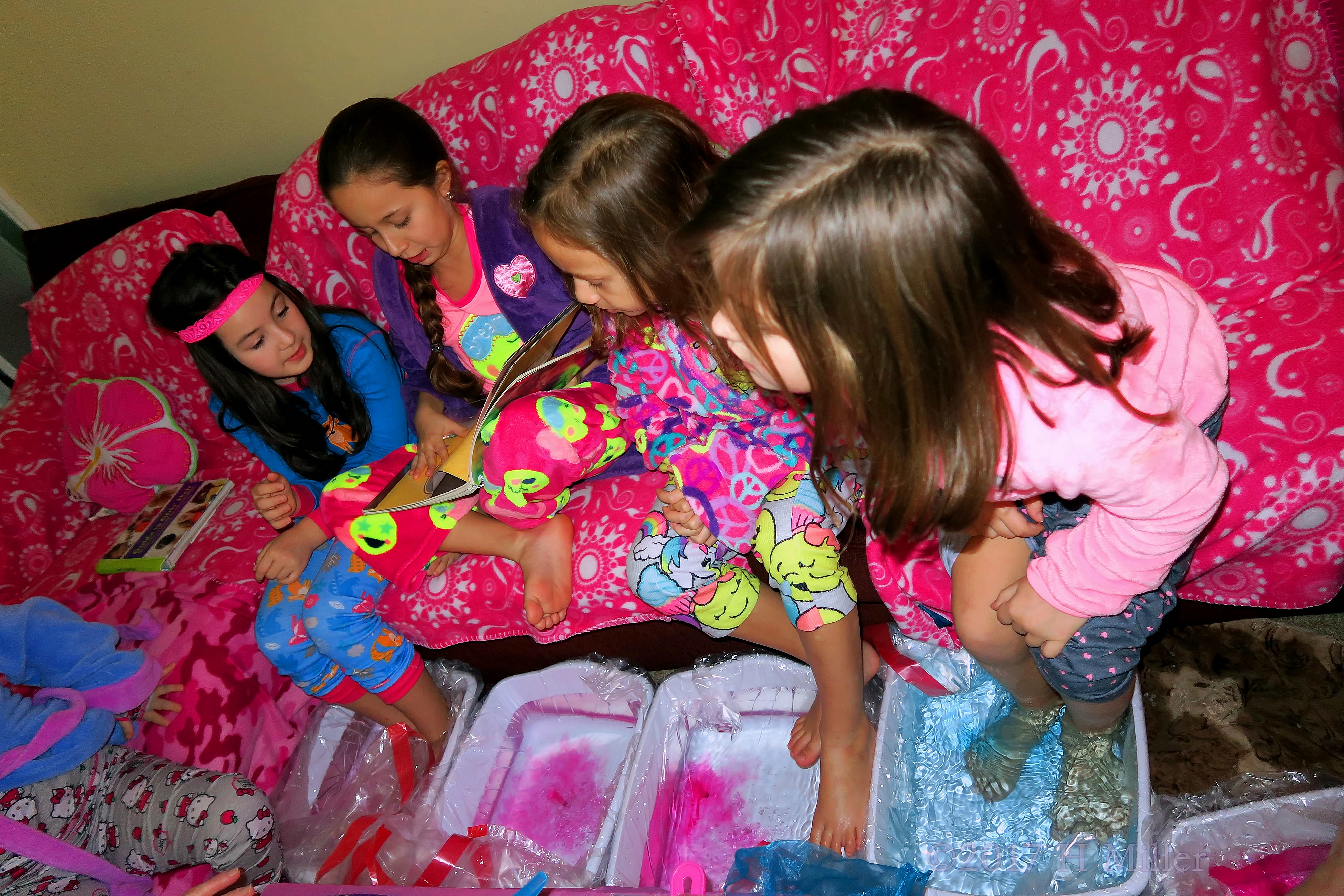 All The Girls Are Perusing The Hair Styles And Nail Art Books. All The Girls Are Perusing The Hair Styles And Nail Art Books.