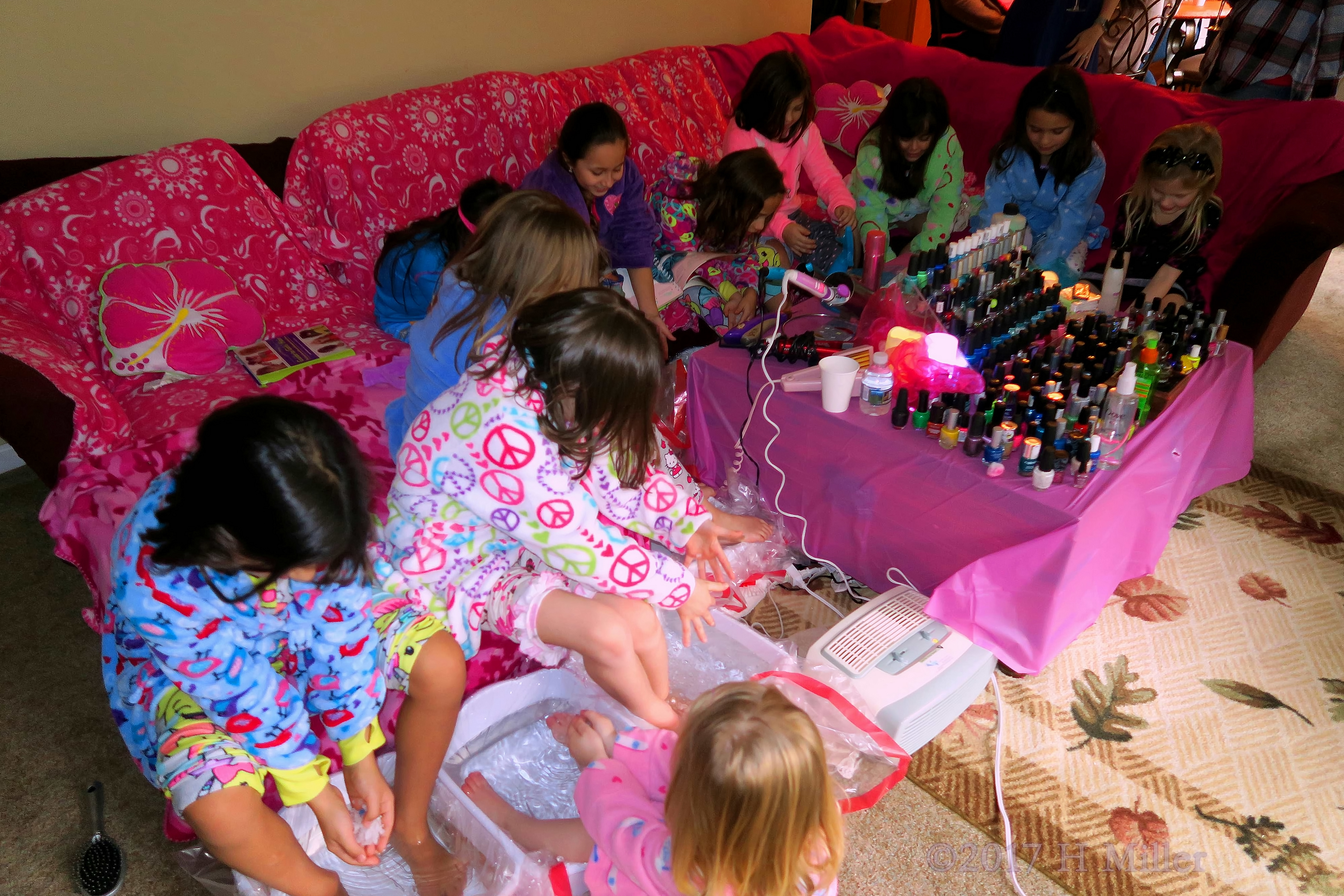 Girls Getting Their Kids Pedicure Footbaths. Girls Getting Their Kids Pedicure Footbaths.