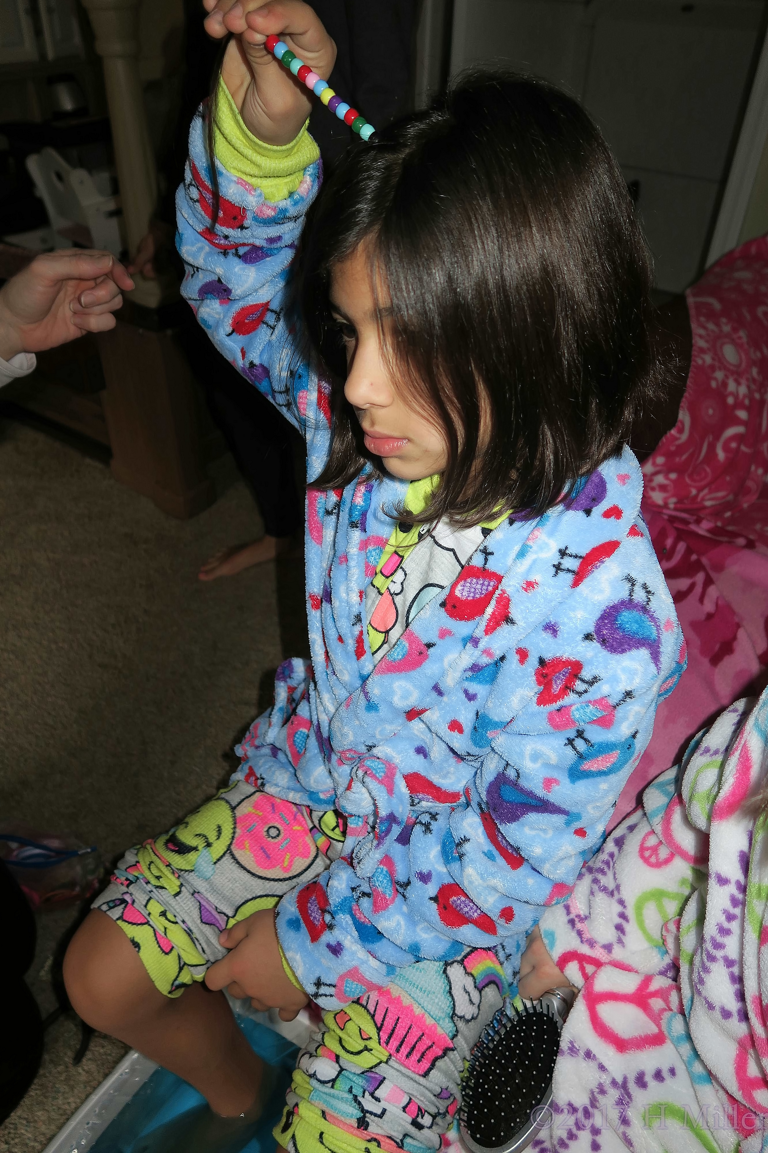 Holding Her Beaded Hair While More Beads Are Added For Her Awesome Girls Hairstyle! Holding Her Beaded Hair While More Beads Are Added For Her Awesome Girls Hairstyle!