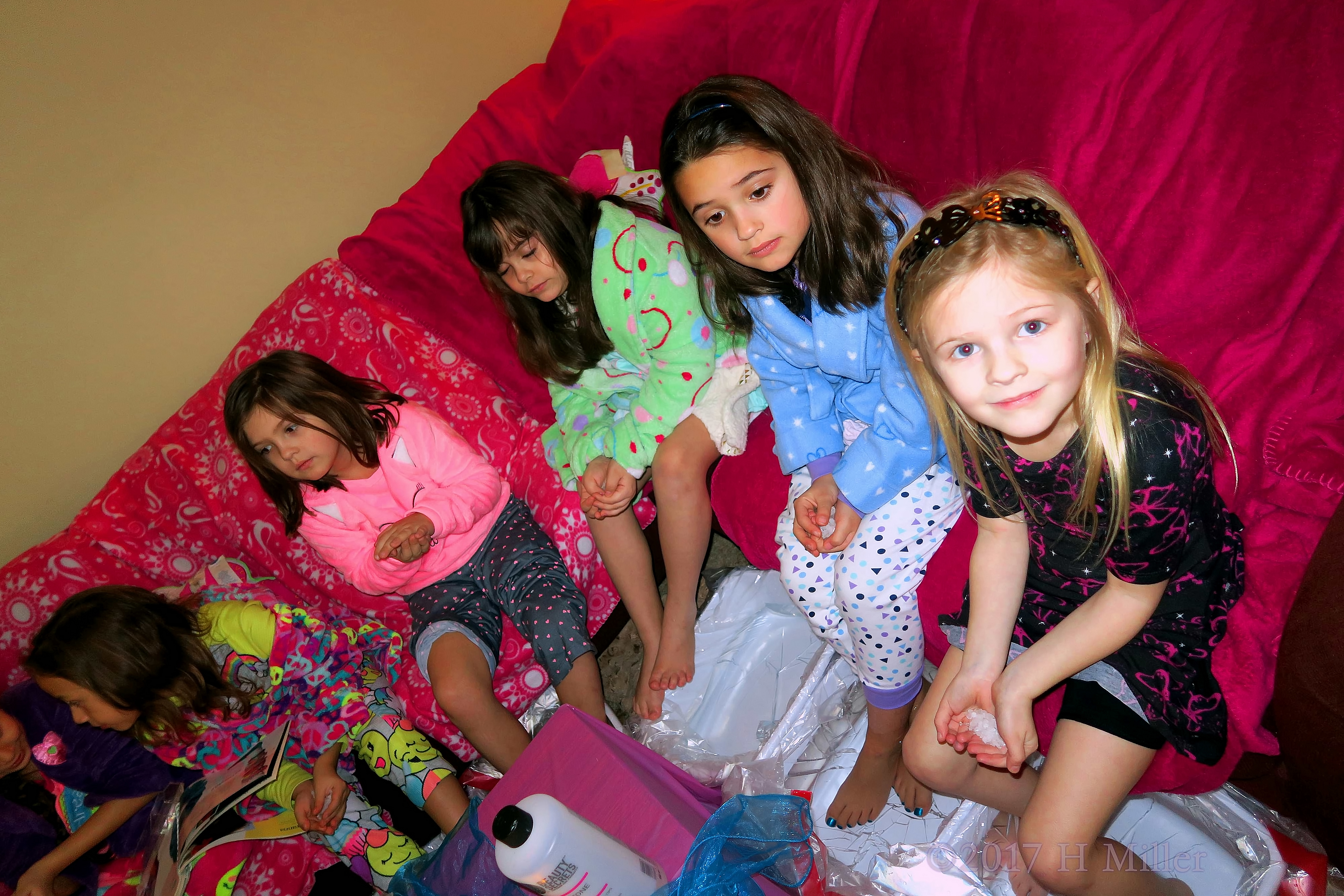 Looking At The Camera Ready To Add The Salt To The Kids Pedicure Footbath. Looking At The Camera Ready To Add The Salt To The Kids Pedicure Footbath.
