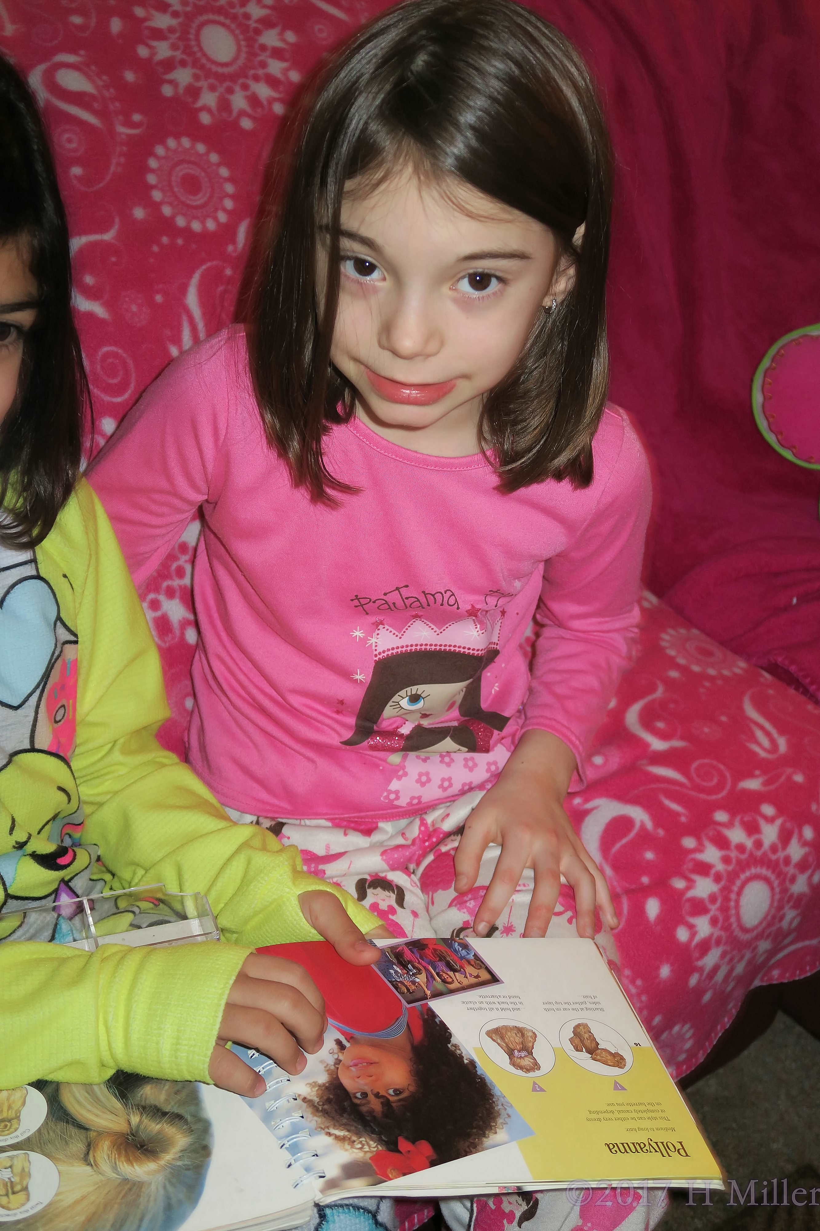 Madison Reading The Girls Hairstyles Book. 