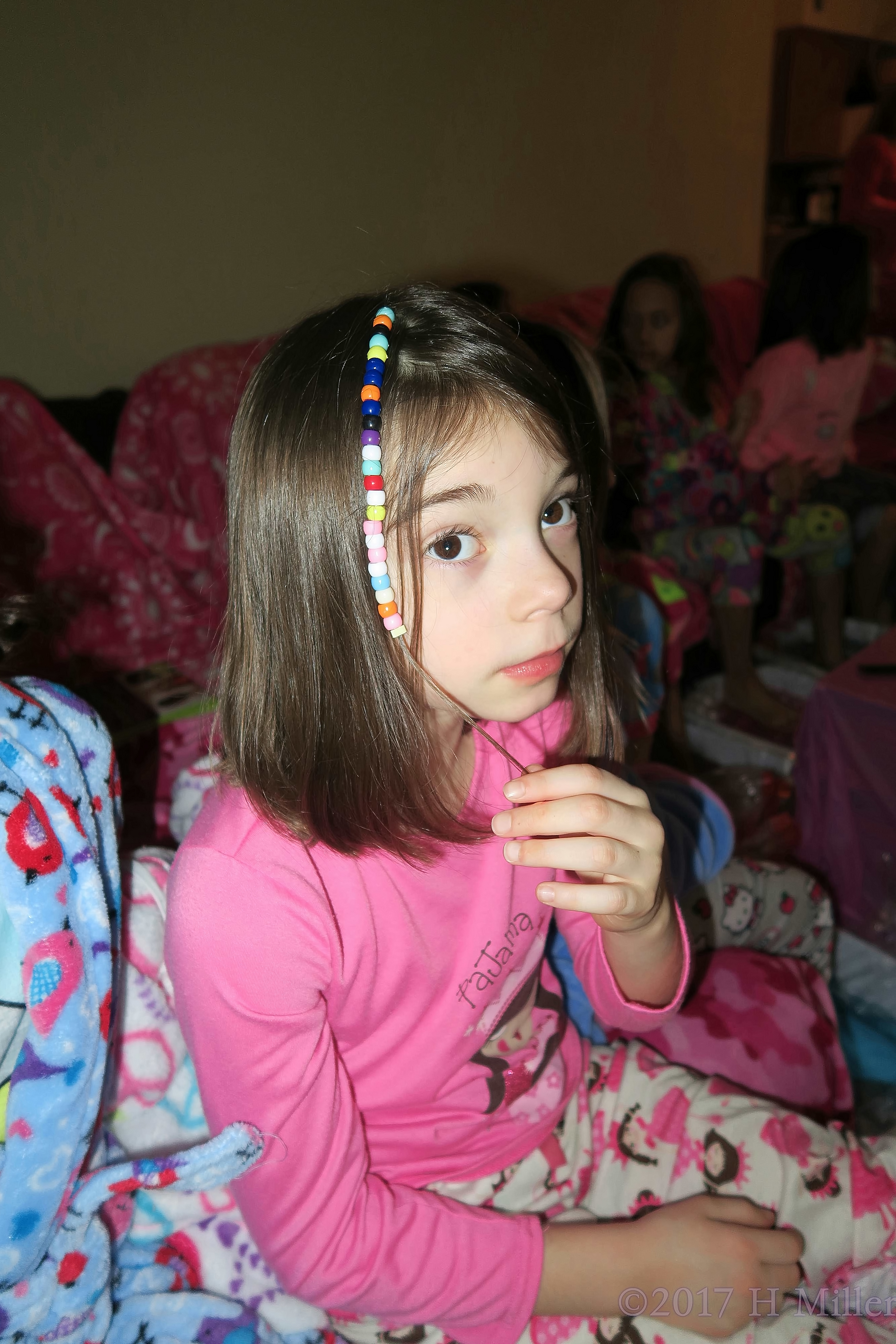 Showing Off Her Adorable Beaded Girls Hairstyle. Showing Off Her Adorable Beaded Girls Hairstyle.