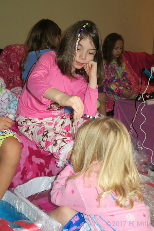 Checking Out Her Friends Beaded Girls Hairstyle. Checking Out Her Friends Beaded Girls Hairstyle.