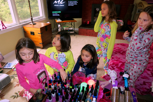 Choosing Nail Polishes During A Group Photo