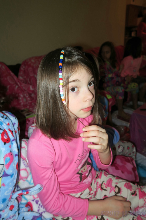 Showing Off Her Adorable Beaded Girls Hairstyle. Showing Off Her Adorable Beaded Girls Hairstyle.