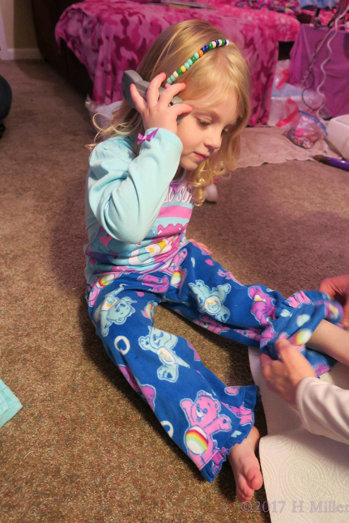 Playing With Her Stylish Beaded Hairstyle. 