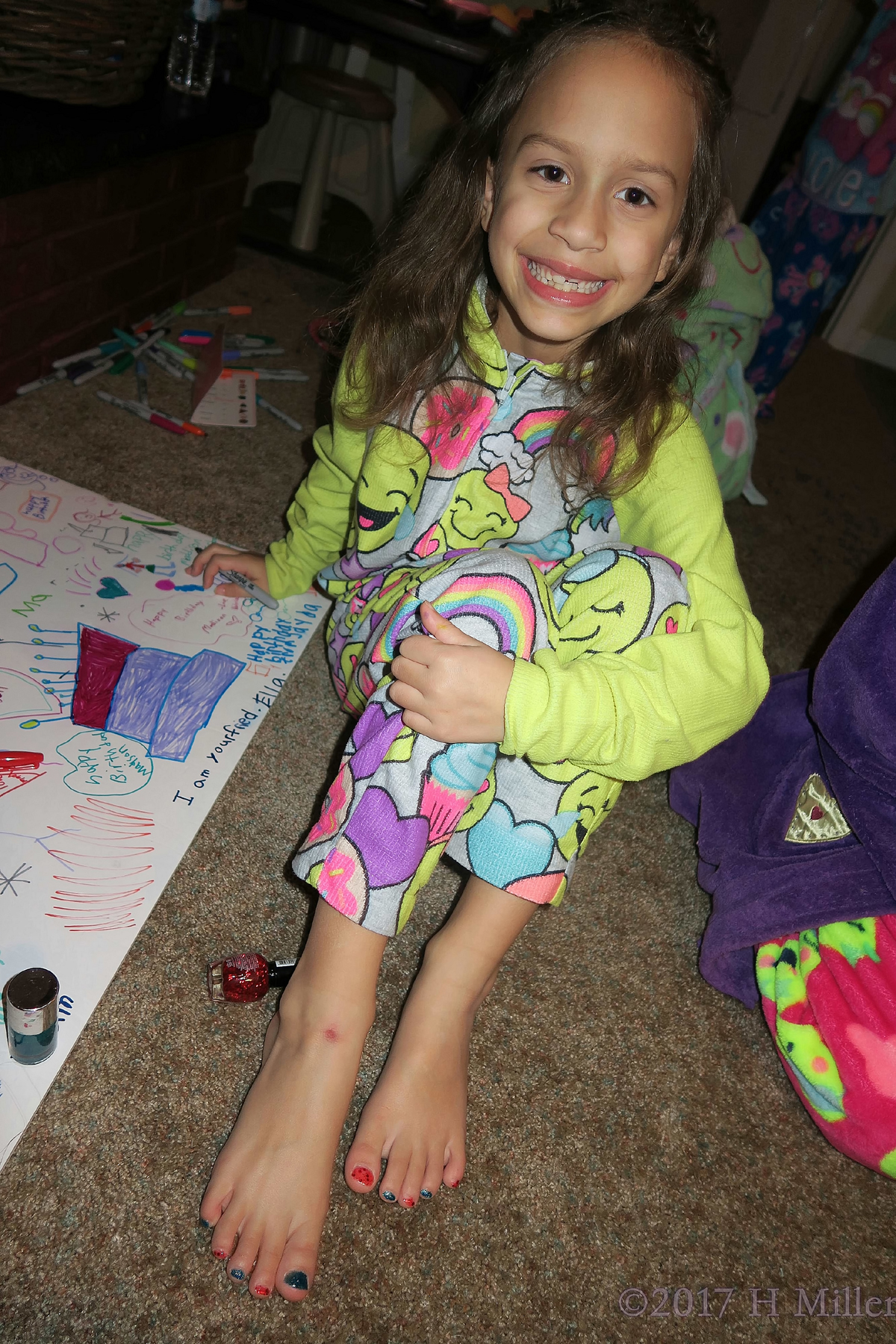 Showing Off Her Kids Pedicure As She Writes On The Spa Birthday Card. 