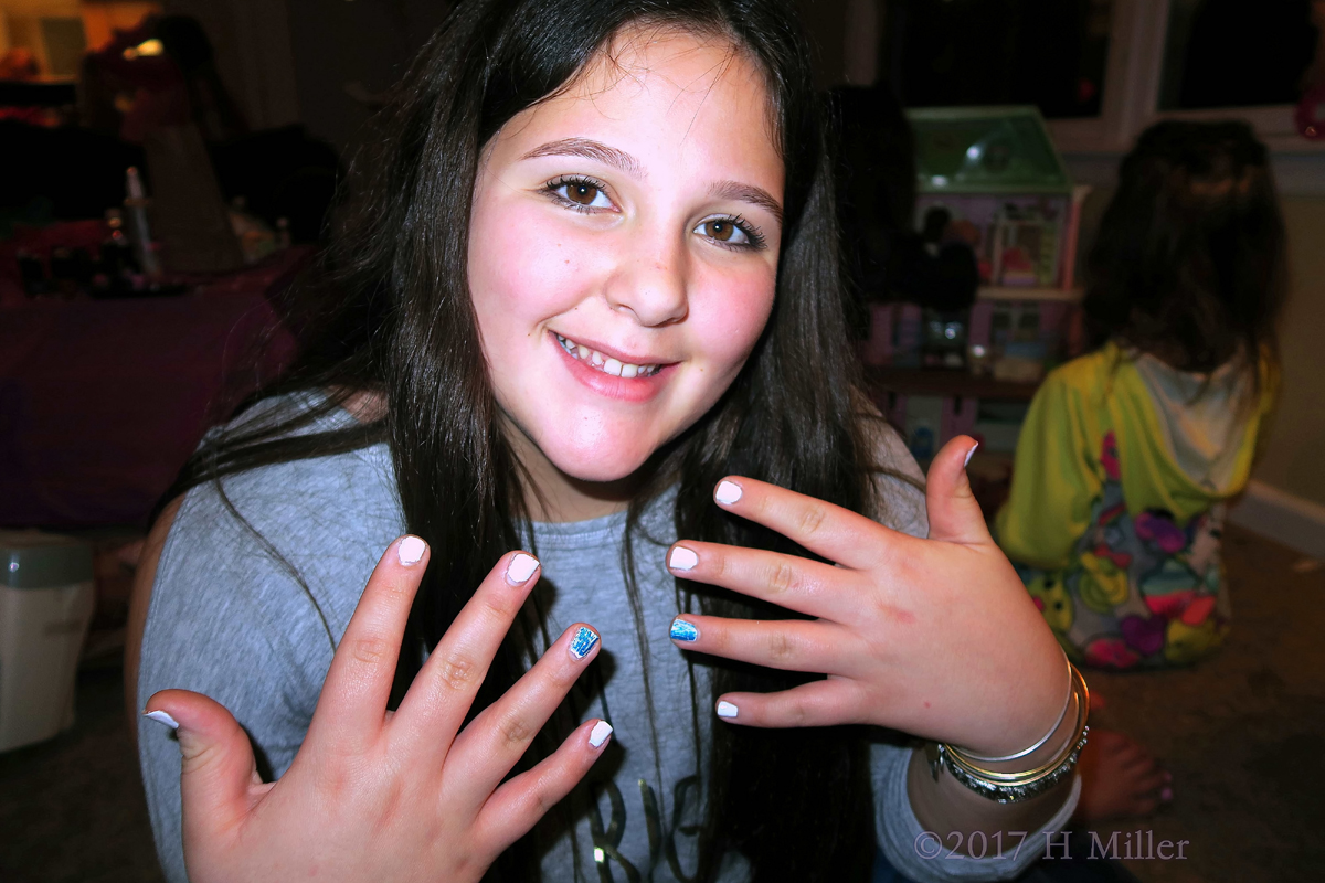Showing Off Her Stylish Nail Art At The Kids Spa. 