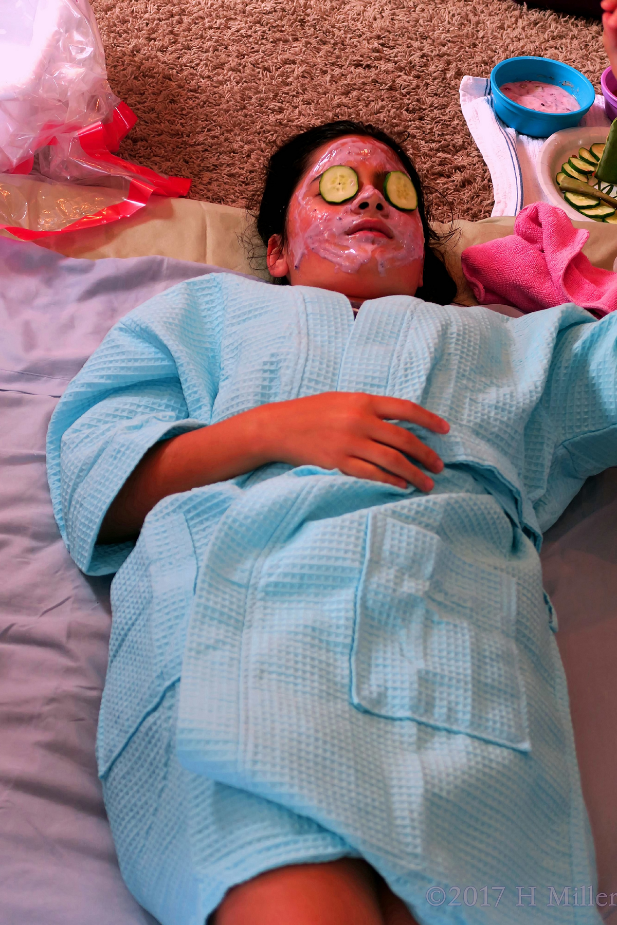Spa Party Guest Relaxes With Her Facial Mask, Enjoying The Kids Spa Party 
