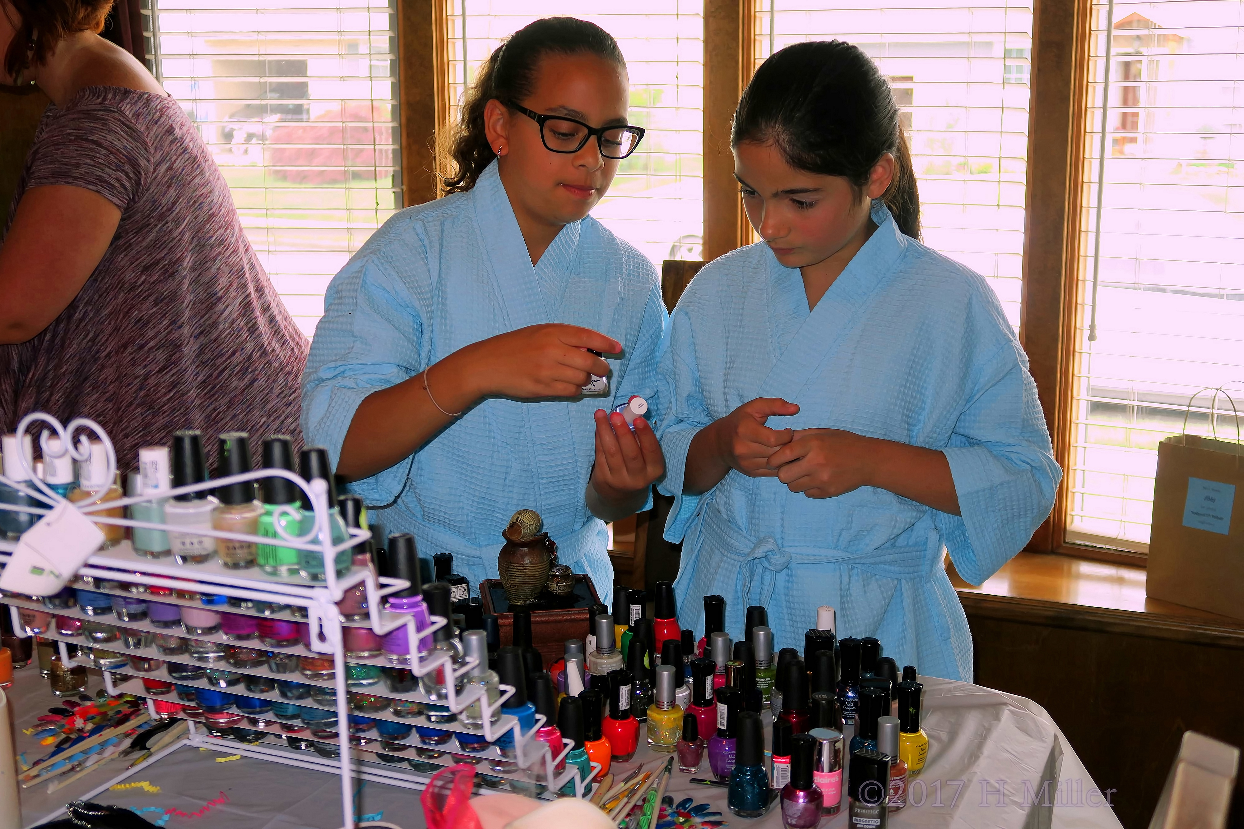 Party Guests Choosing Their Favorite Nail Polish. 