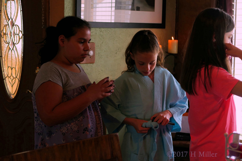 Adjusting Her Blue Spa Robe