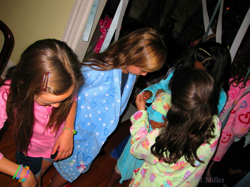 Putting On Their Spa Robe Putting On Their Spa Robe