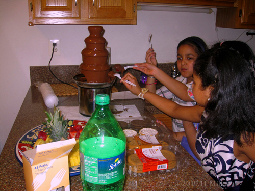 Girls Are Excited To Taste The Mouth Watering Chocolate Fountain!