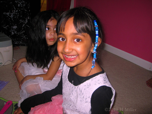 Look At Her Kids Hairstyle! She Looks Happy With The Blue Beads In Her Hair