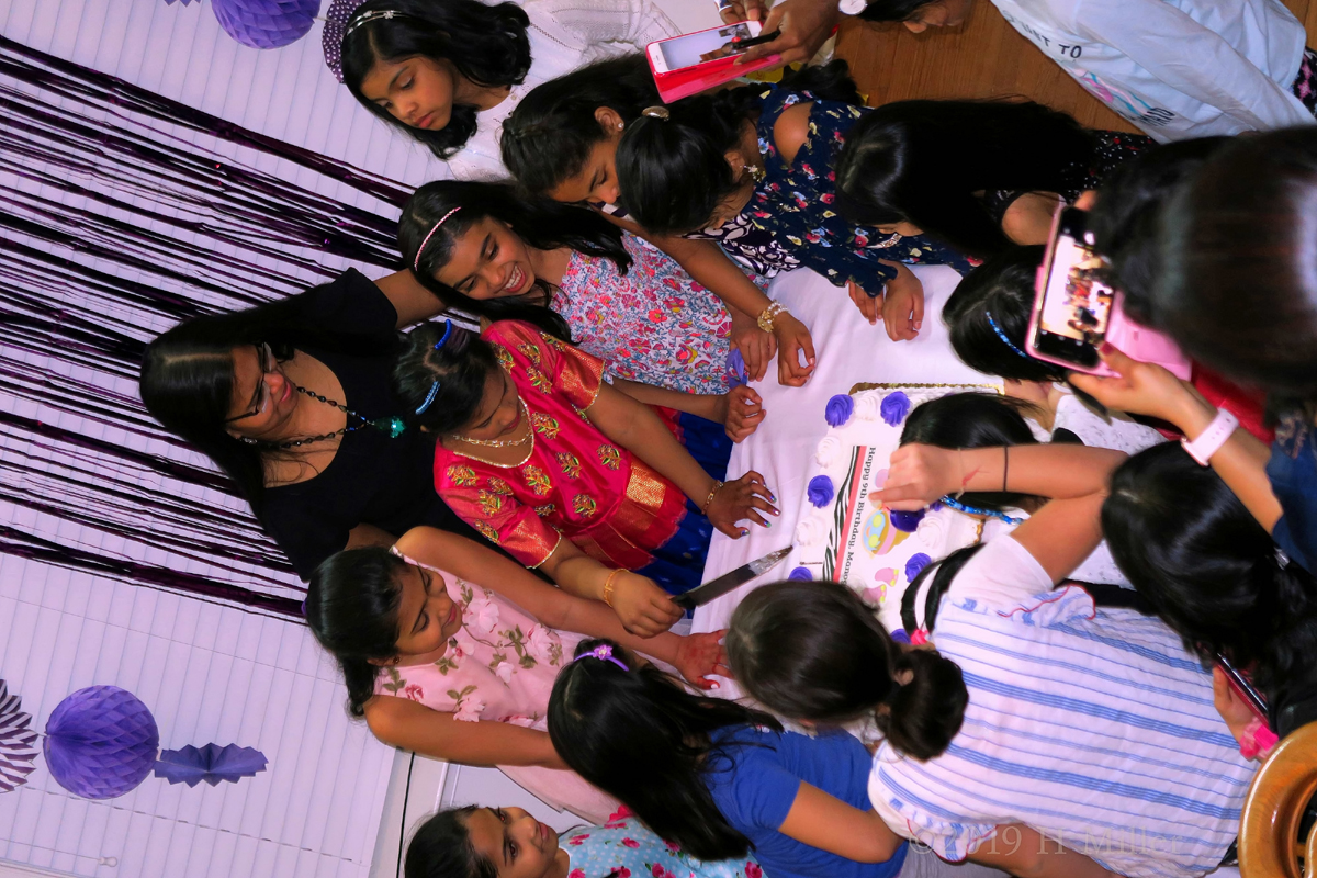 Everyone Is Eagerly Waiting For The Birthday Girl To Cut The Cake 