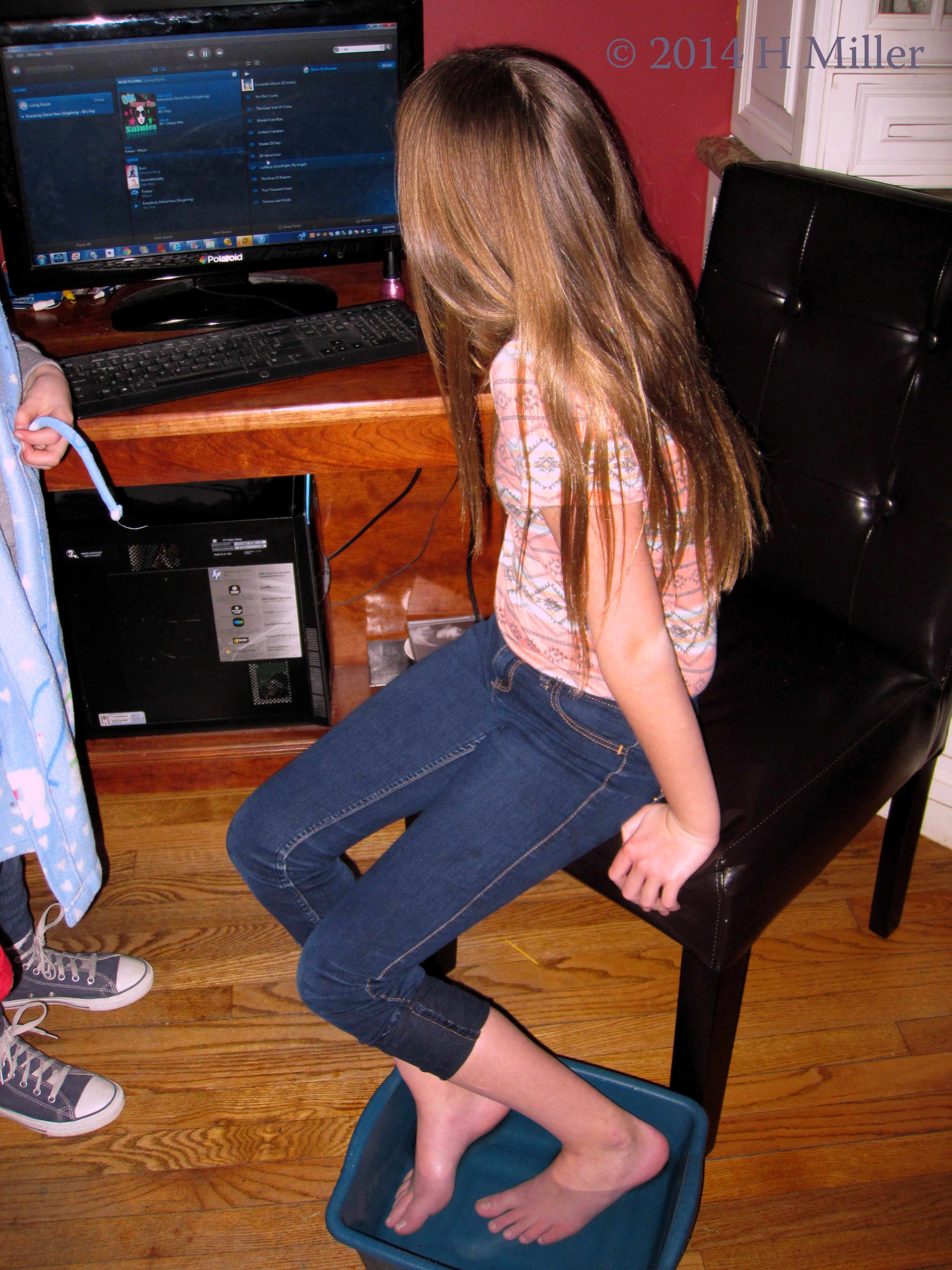 Enjoying A Foot Soak In Herbal Water Enjoying A Foot Soak In Herbal Water