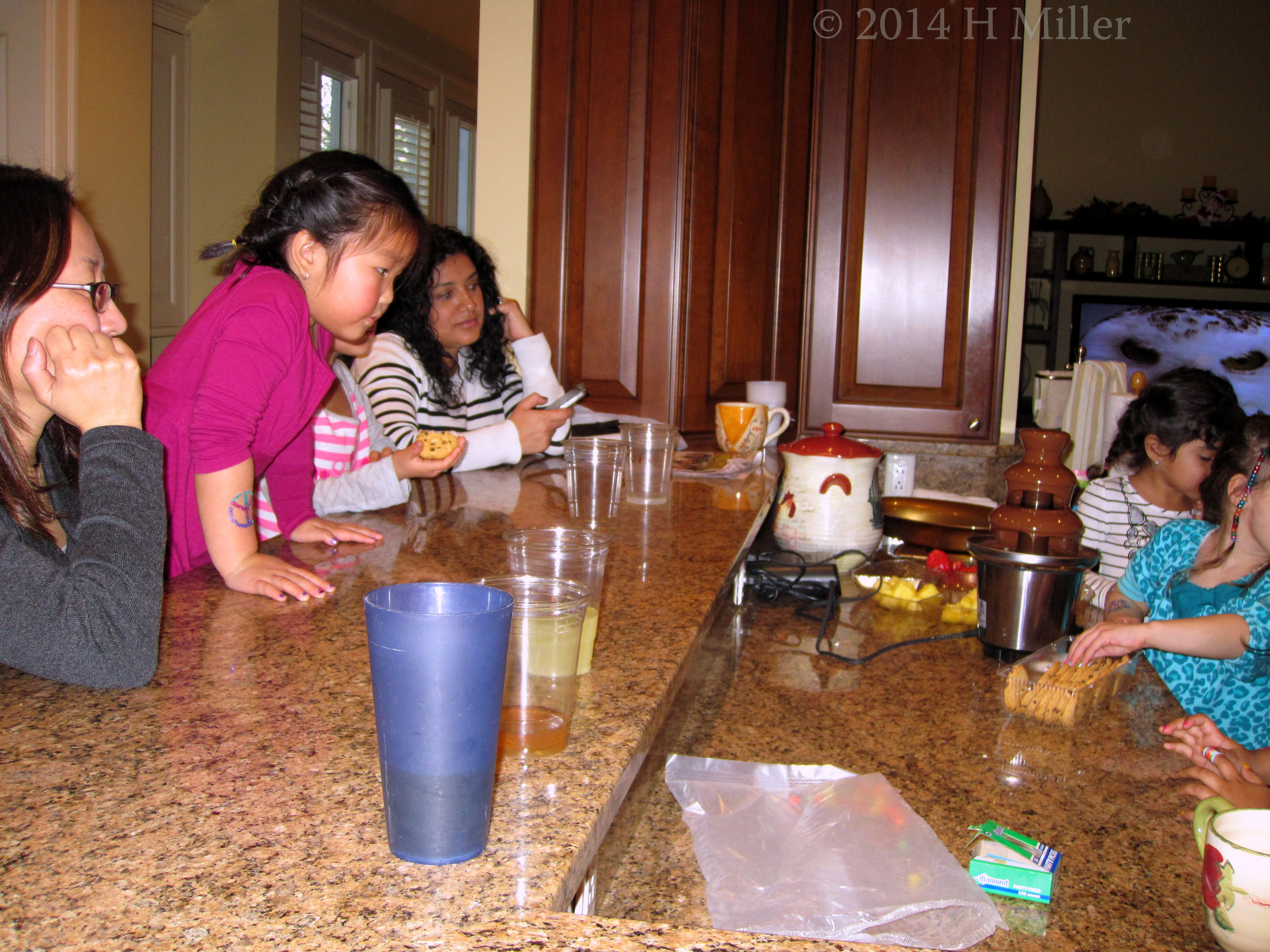 The Girls Eating Birthday Party Goodies Like Melted Chocolate On Fruits And Cookies The Girls Eating Birthday Party Goodies Like Melted Chocolate On Fruits And Cookies