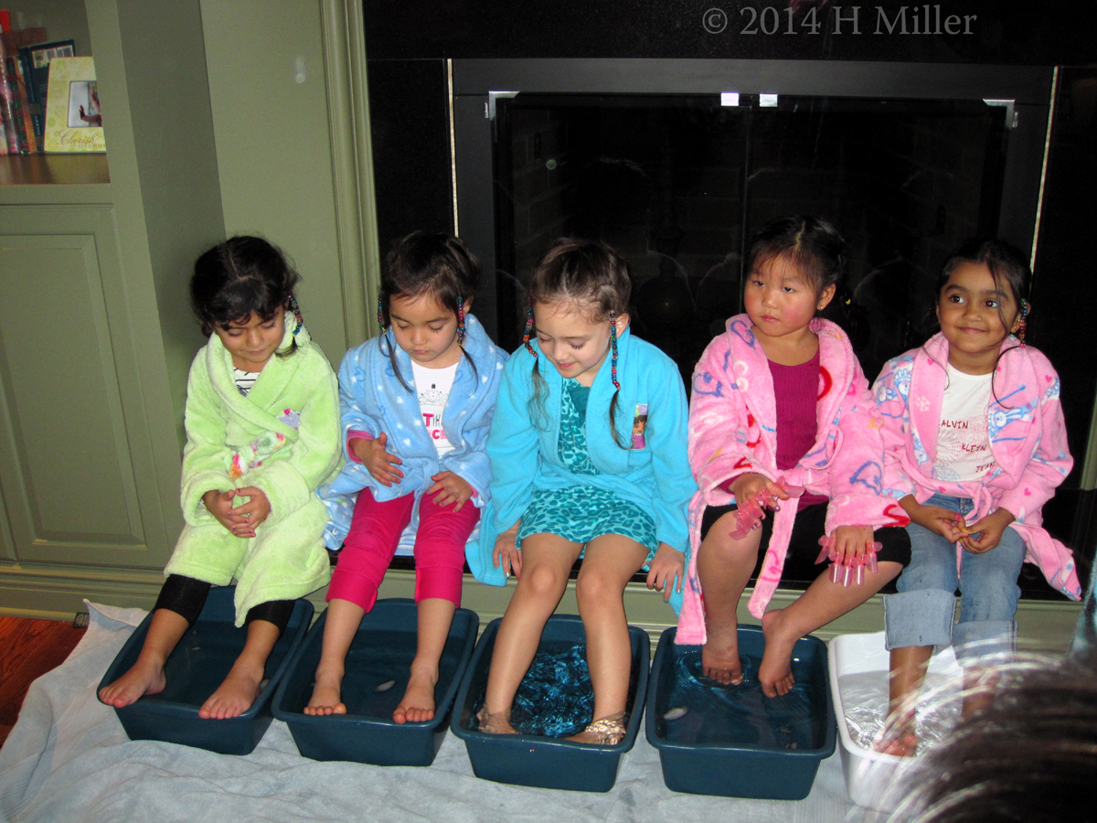 Enjoying A Relaxing Footbath With Friends At Maya's Spa Birthday Party.