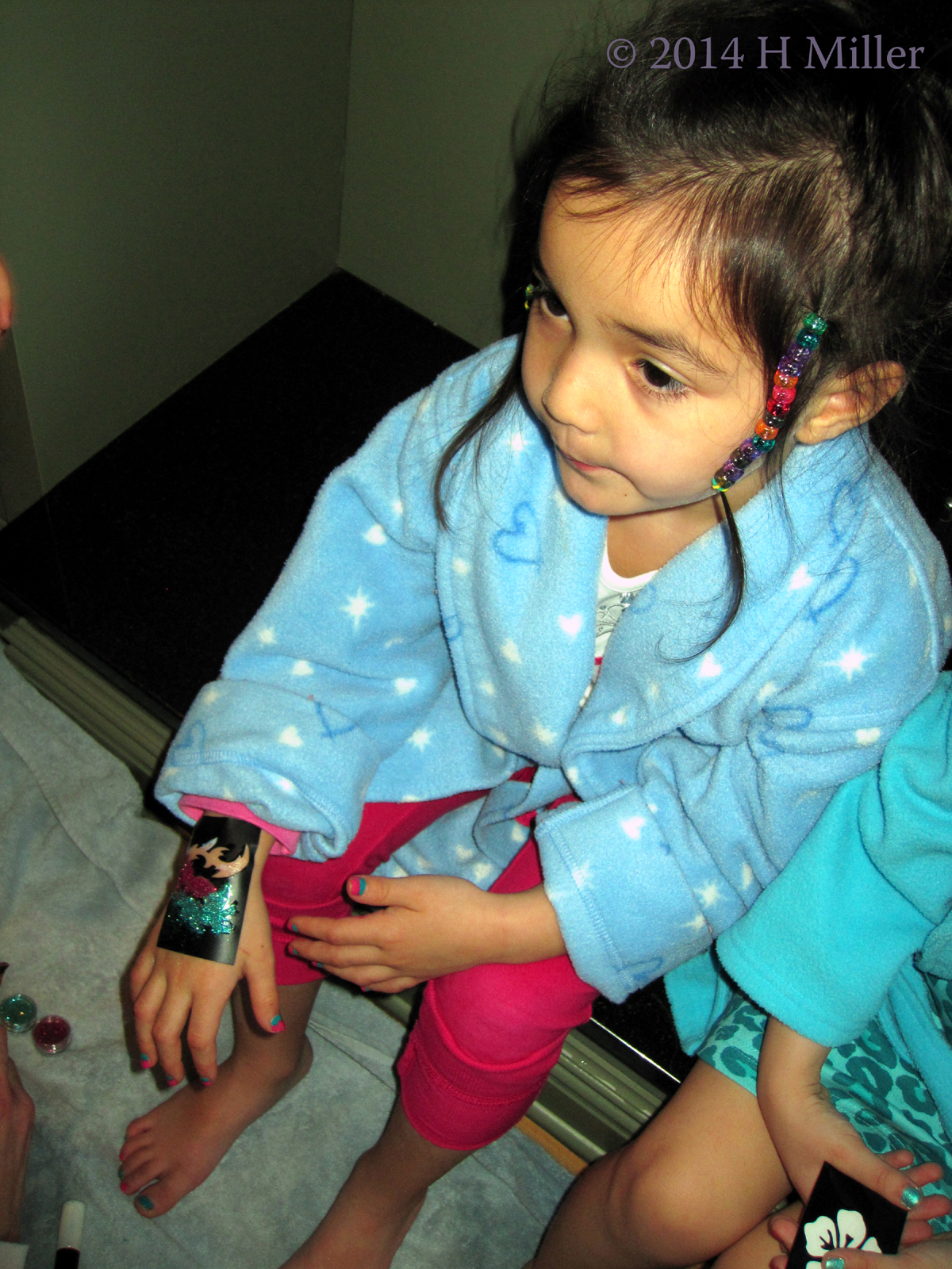 Getting A Glitter Temprary Tattoo On Her Hand Getting A Glitter Temprary Tattoo On Her Hand