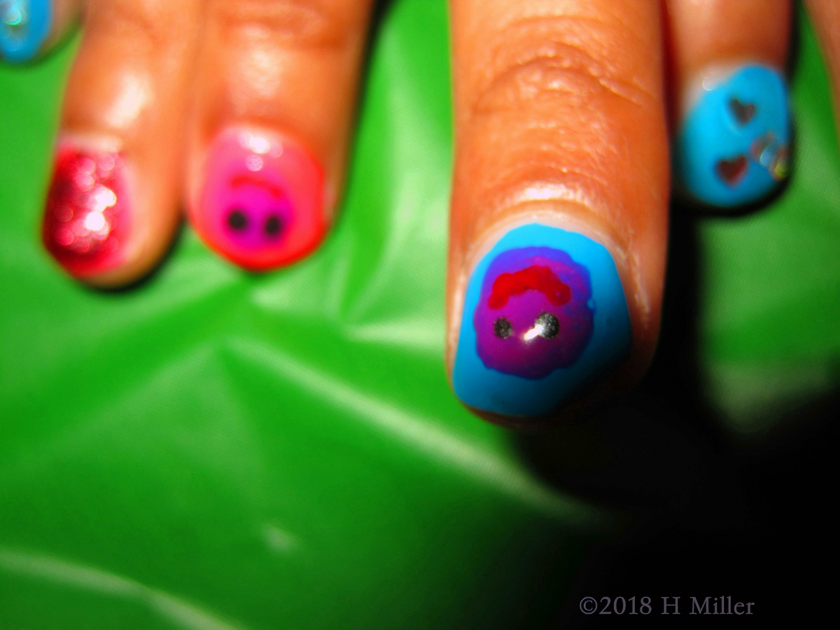 Multicolored Nail Art Based With An Assorted Smiley Facey Overlays