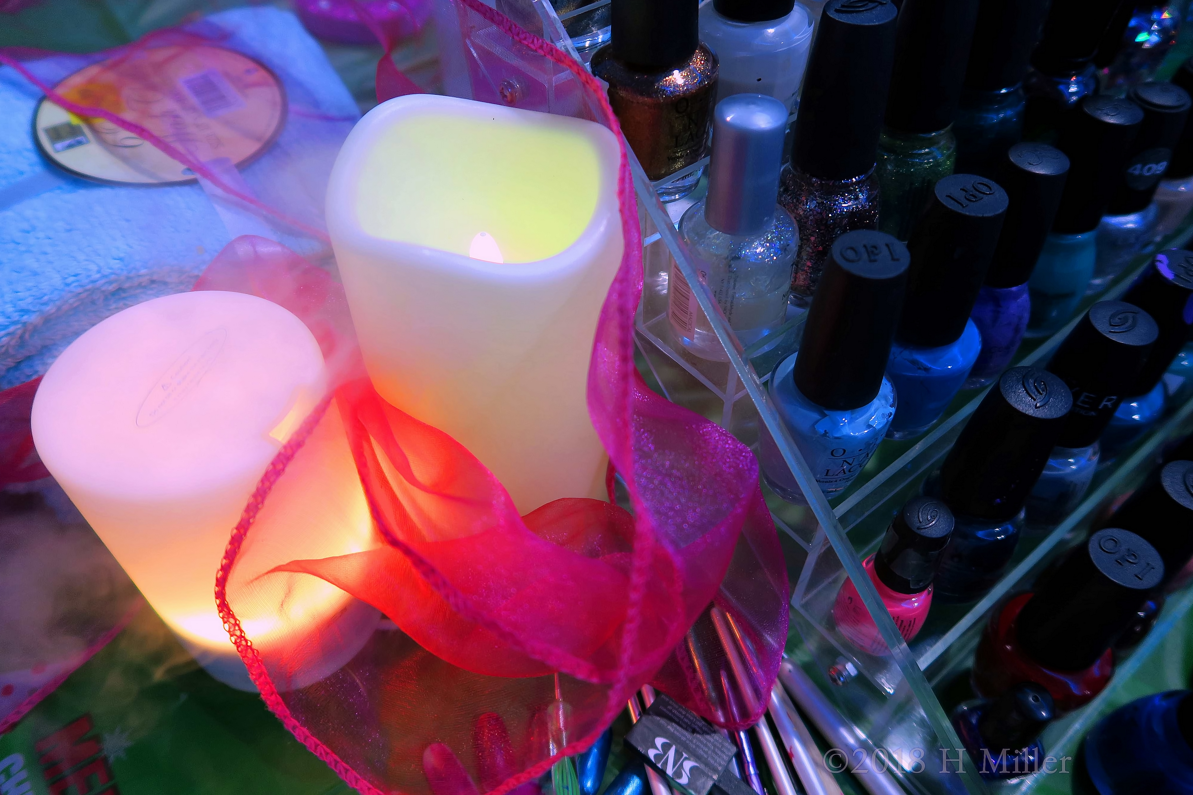 OPI Nail Colors On Stack Beside Beautifully Lit Candles OPI Nail Colors On Stack Beside Beautifully Lit Candles