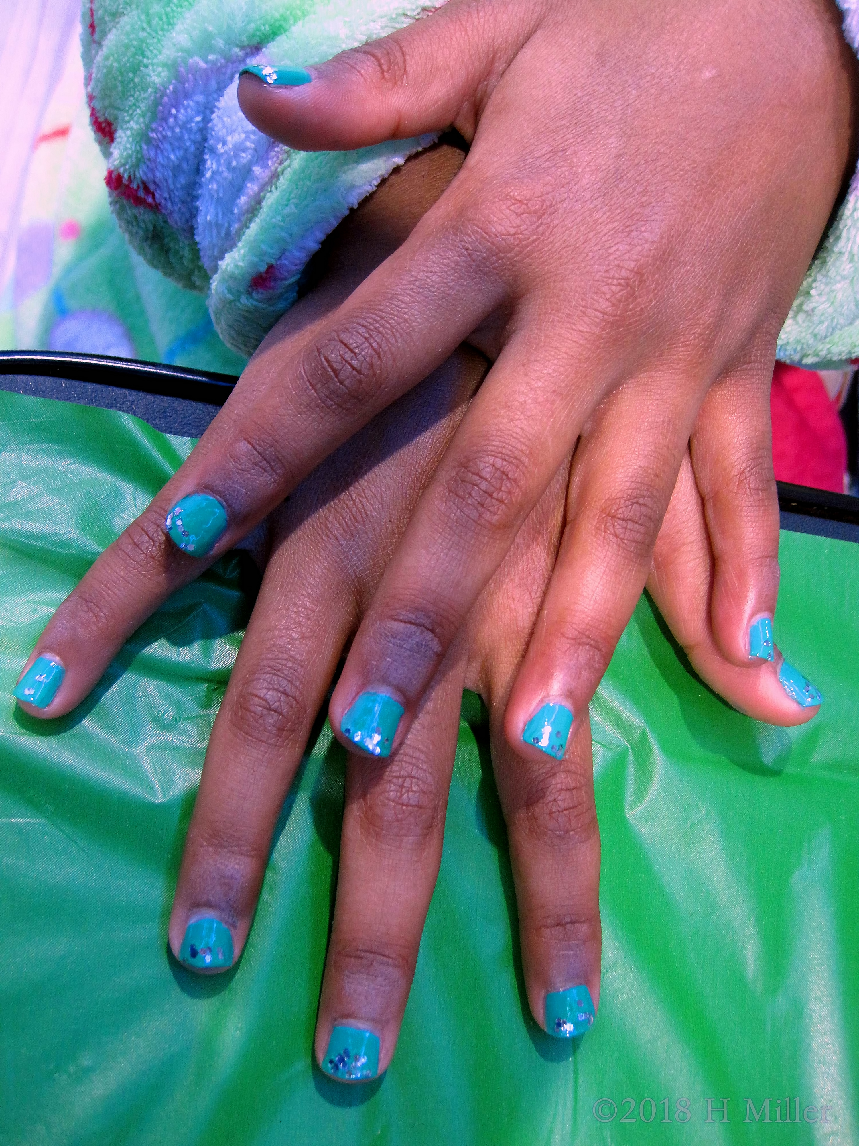 Teal Base Kids Manicure With Fun Glitter Overlay Teal Base Kids Manicure With Fun Glitter Overlay
