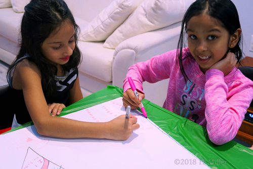 Meesha And Her Friend Having Fun Drawing On The Spa Birthday Card At Her Birthday Party