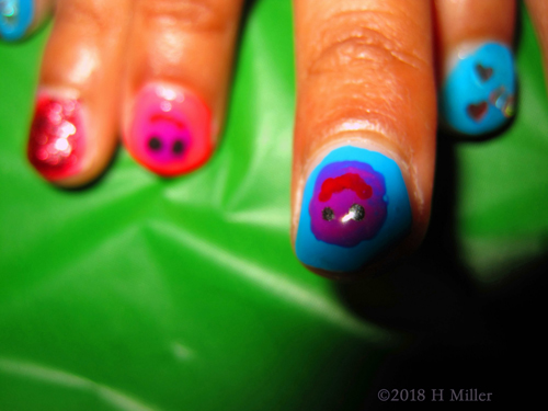 Multicolored Nail Art Based With An Assorted Smiley Facey Overlay