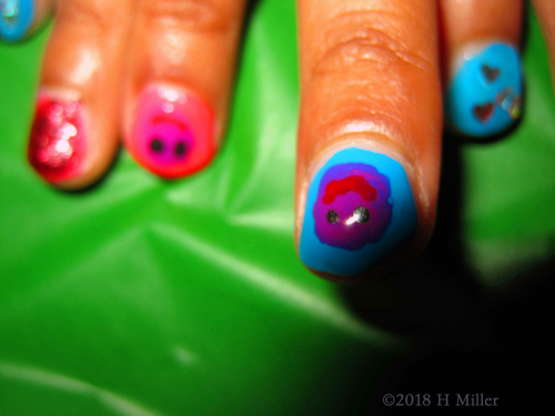 Multicolored Nail Art Based With An Assorted Smiley Facey Overlay Multicolored Nail Art Based With An Assorted Smiley Facey Overlay