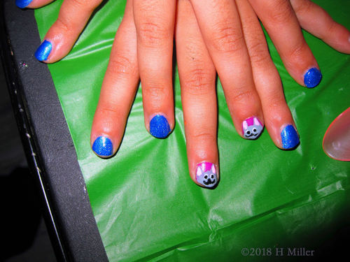 Vibrant Shimmer Blue Girls Manicure With Pink Kitty Nail Design. Vibrant Shimmer Blue Girls Manicure With Pink Kitty Nail Design.