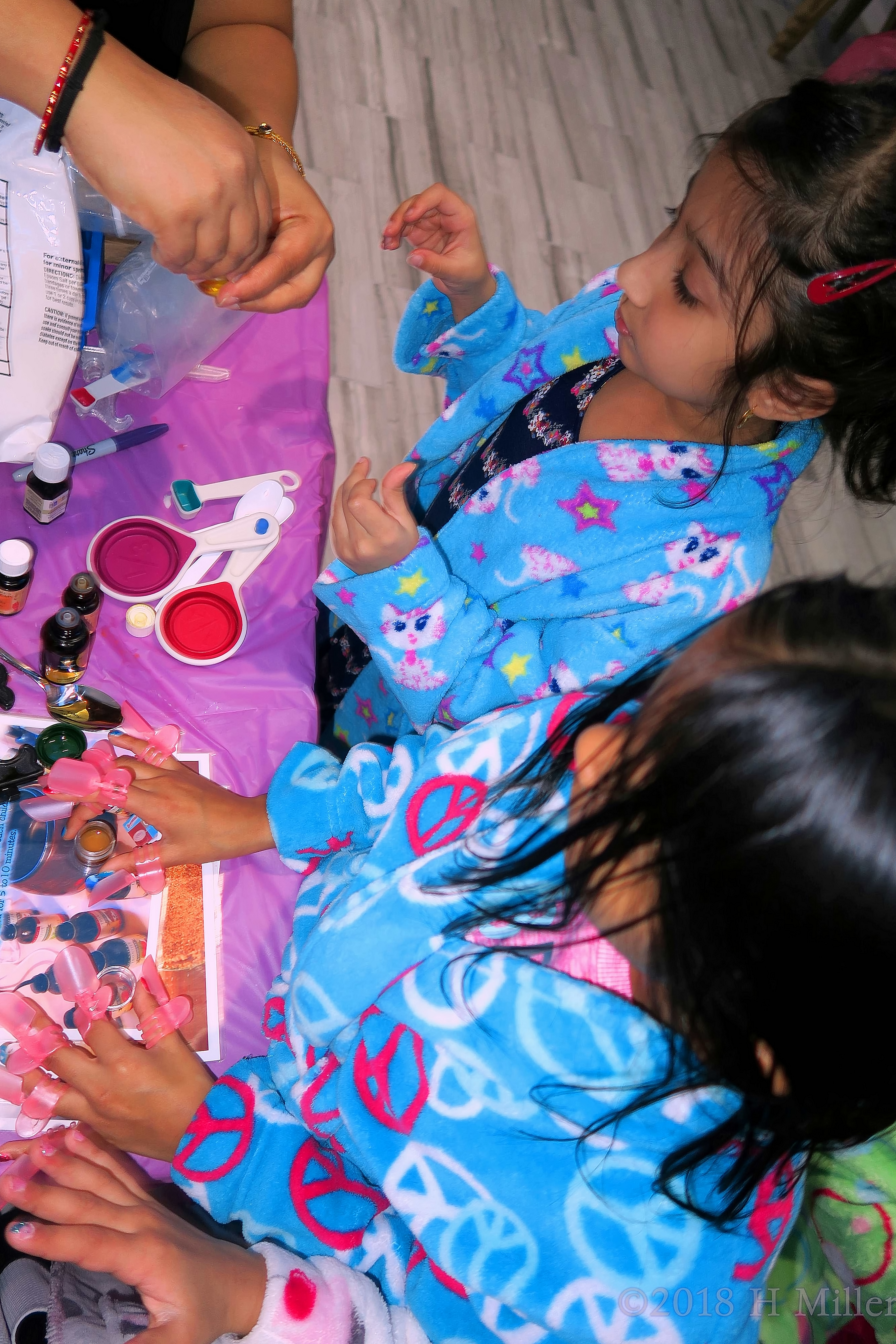 Little Party Goers Enjoy Making Kids Crafts While Their Girls Manicures Dry