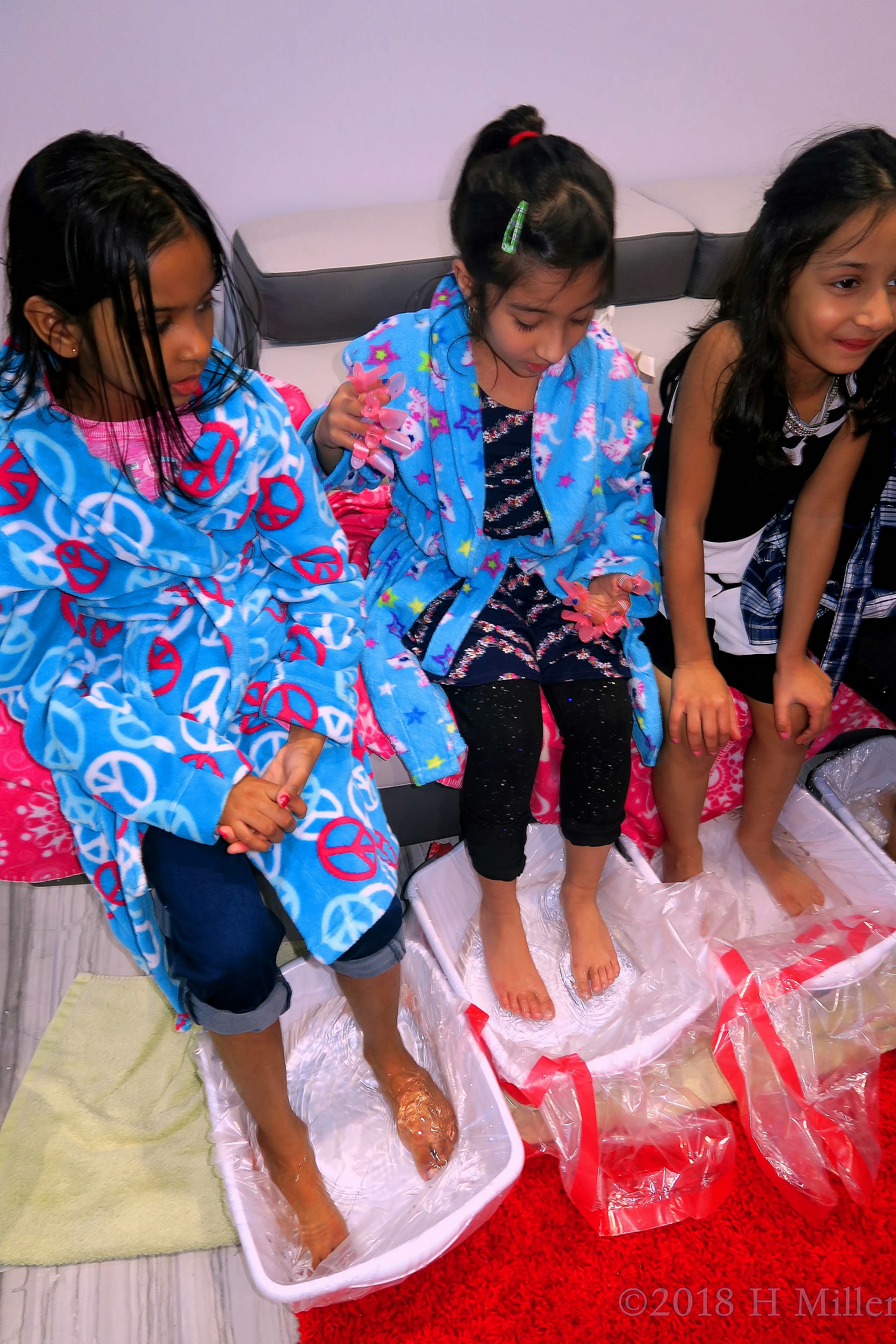 Relaxed and Comfy In Blue Printed Spa Robes During Pedicures For Girls. 