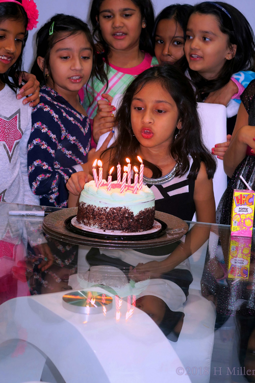 Meesha Blowing Out Candles On Her Cake