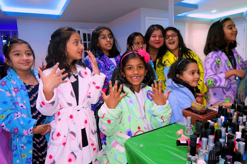 Party Guests At The Nail Art Design Station Showing Off Their Nail Designs Party Guests At The Nail Art Design Station Showing Off Their Nail Designs