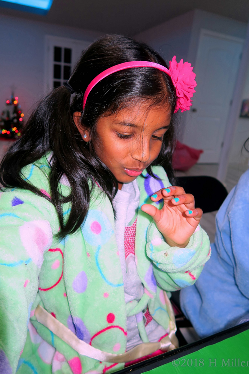 This Party Guest Blowing On Her Electric Blue Girls Manicure So It Drie