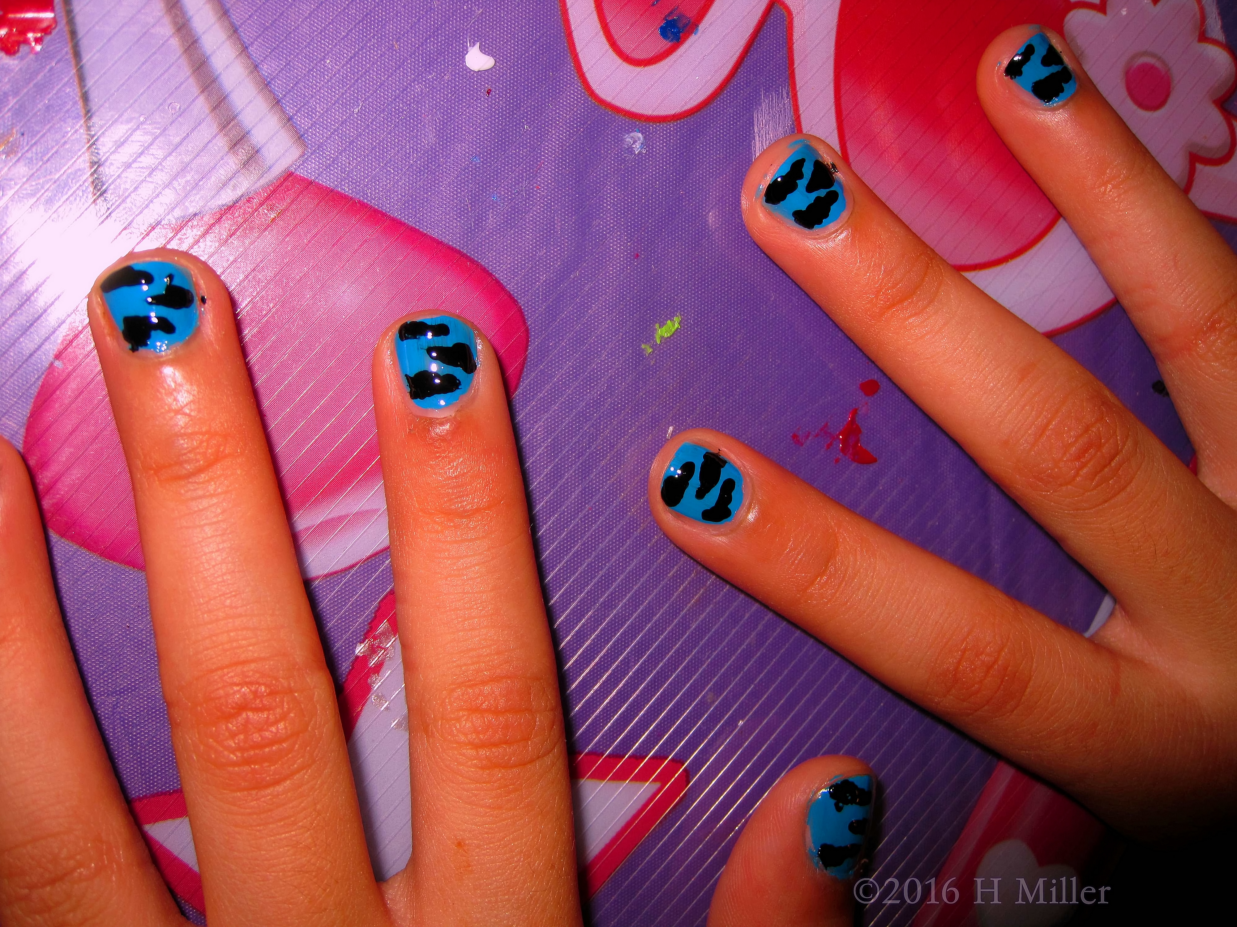 Close Up Of Blue Background Kids Manicure With Black Zebra Stripes Nail Design Close Up Of Blue Background Kids Manicure With Black Zebra Stripes Nail Design