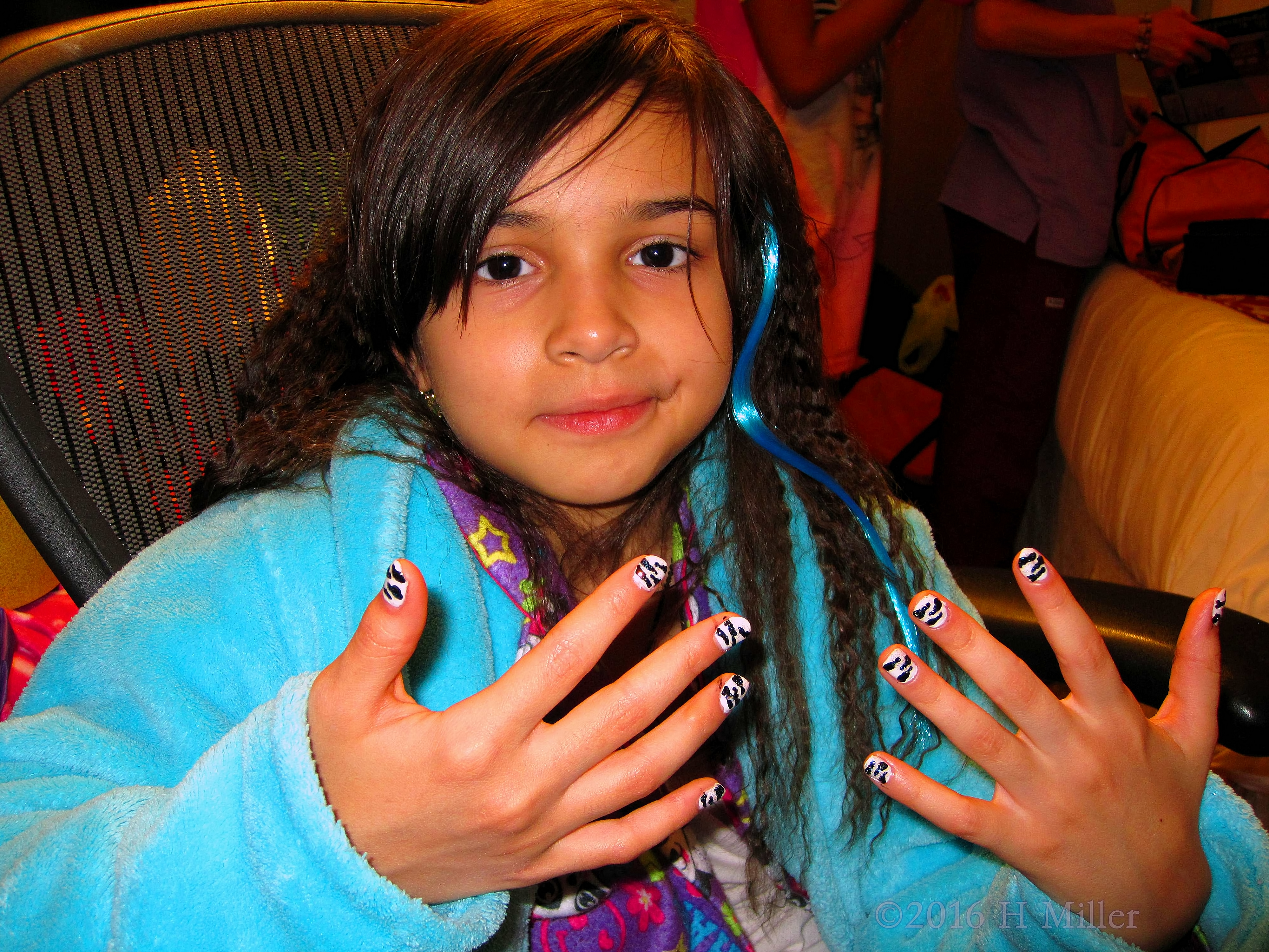 Zebra Nail Design On This Girls Manicure With A Blue Spa Robe 