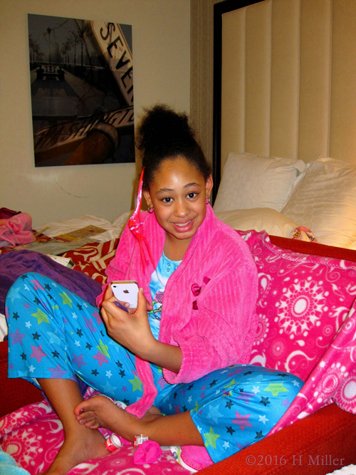 Pink Robed Spa Girl With Her Cellphone