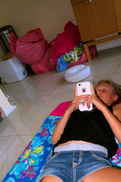 On Her Phone In The Facials And Massage Area. On Her Phone In The Facials And Massage Area.