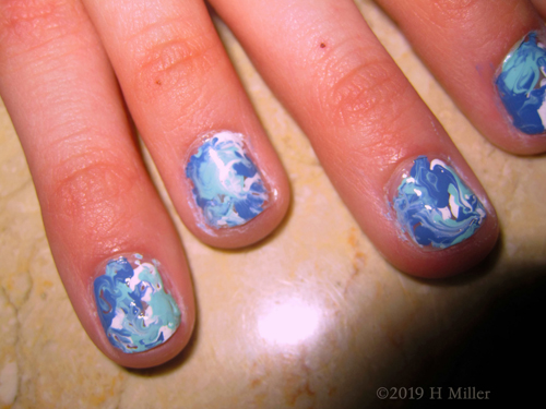 The Most Swirly Part Of The Marbled Kids Nail Art For This Party Guest!