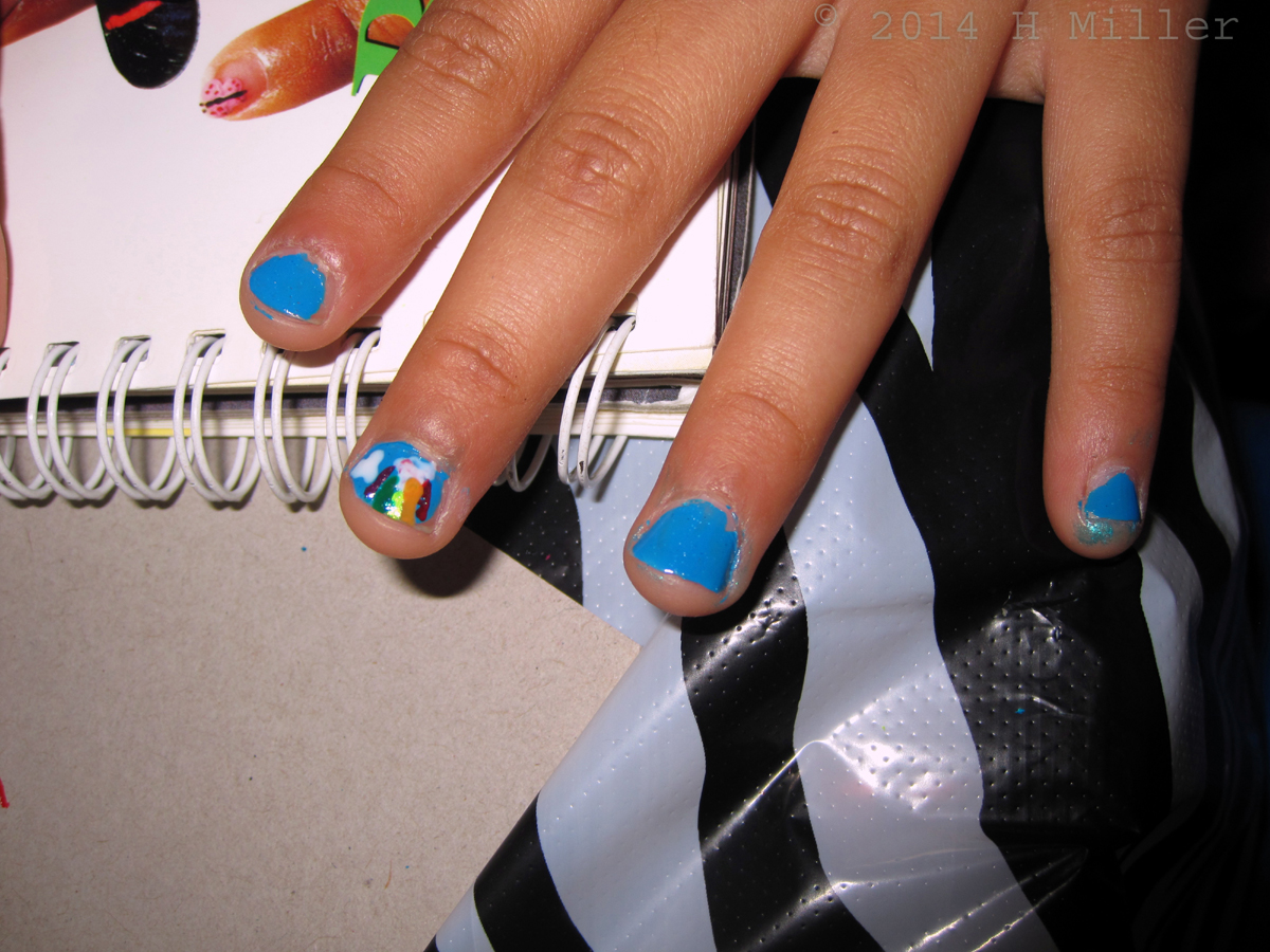 A Rainbow And Clouds Nail Art 