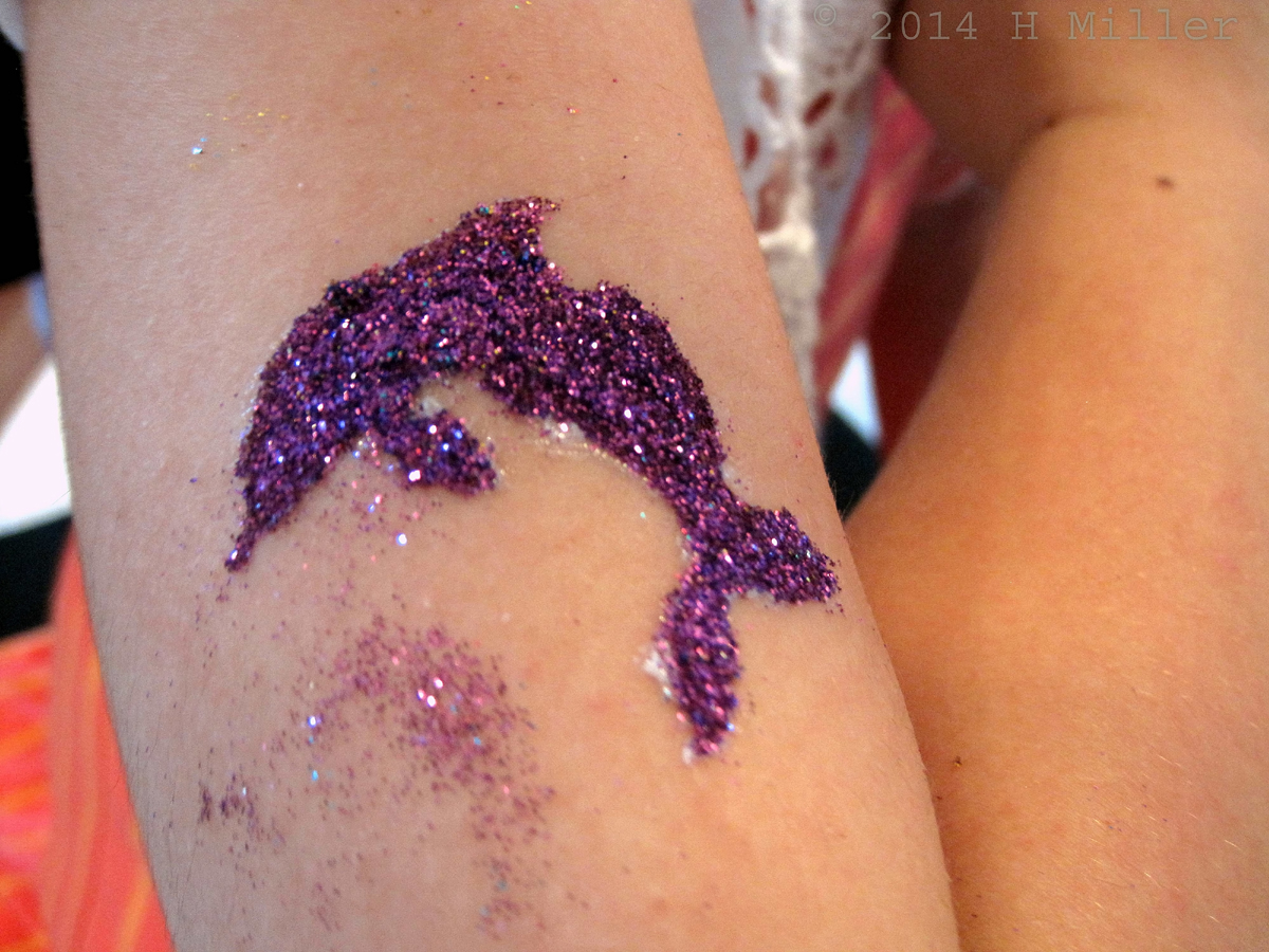 Close Up Of Purple Dolphin Done In Body Glitter 