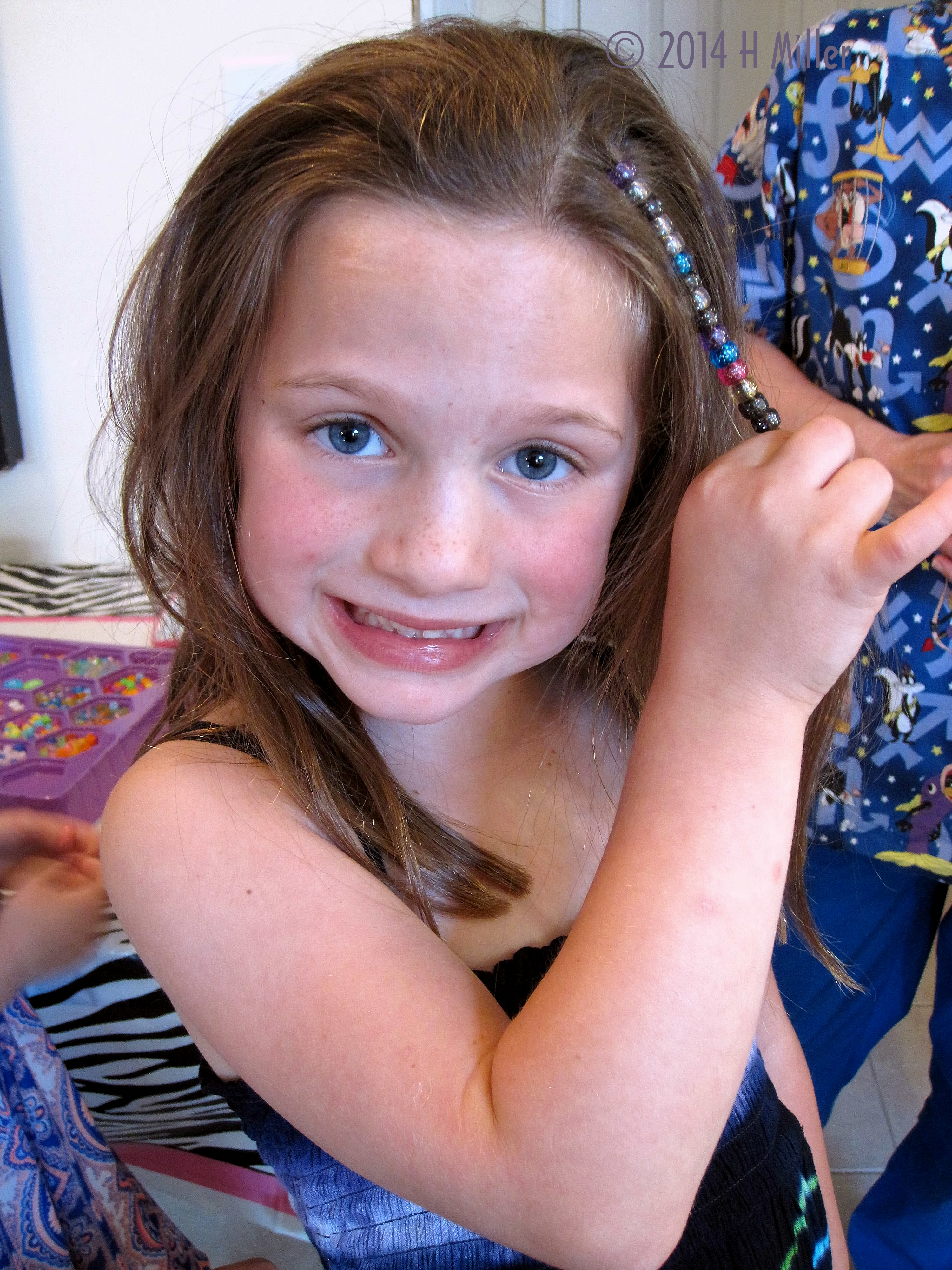 Hair Styled With Beads At Navya's Spa Party Hair Styled With Beads At Navya's Spa Party