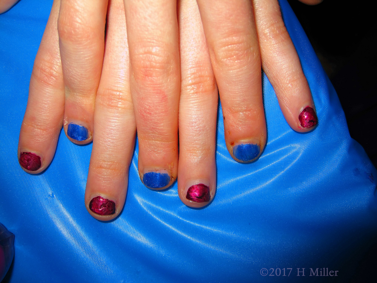 A Very Lovely Girls Manicure With Blue And Pink Shattered Nails!